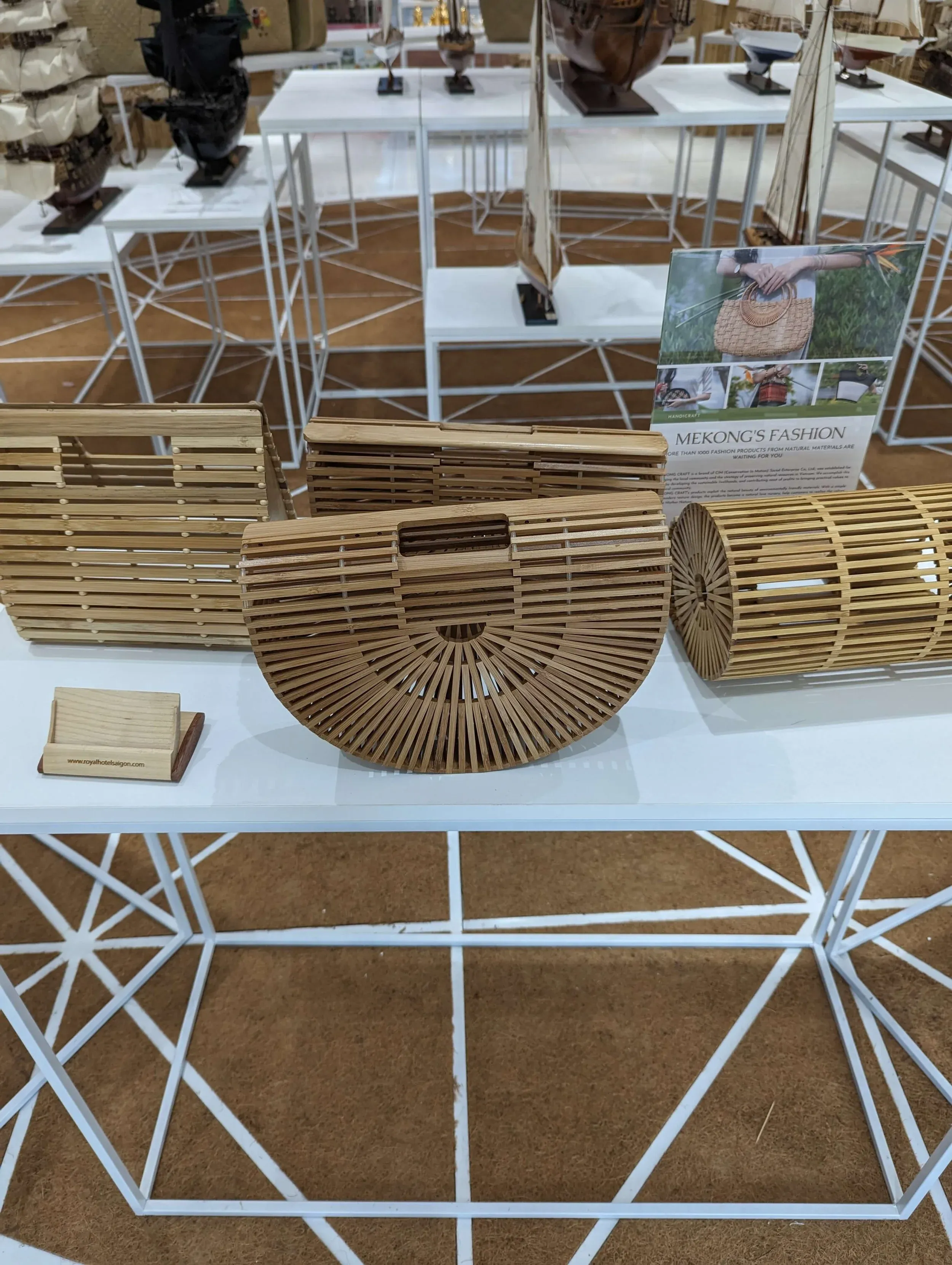 Slatted bamboo handbags displayed at a shop in Vietnam.